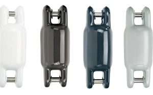 Four different colored boat fenders lined up